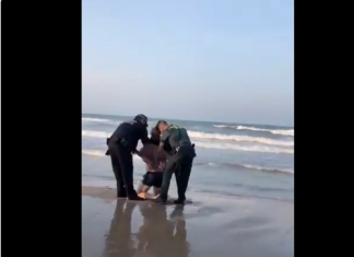 Detenido por negarse a salir del agua con bandera roja